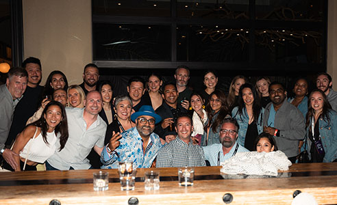 Group posing with Paresh Vadavia at PareshConnect during Rakuten Optimism 2024.