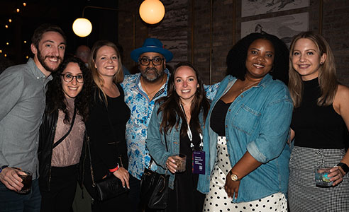 Group posing with Paresh Vadavia at PareshConnect during Rakuten Optimism 2024.