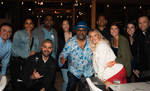 Group posing with Paresh Vadavia at PareshConnect during Rakuten Optimism 2024.