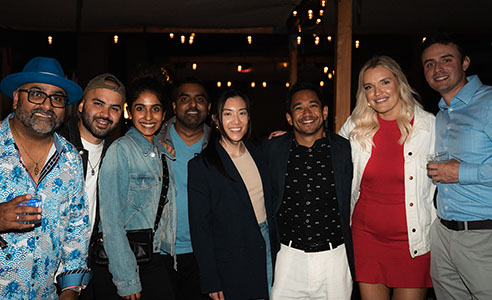 Group posing with Paresh Vadavia at PareshConnect during Rakuten Optimism 2024.